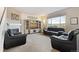 Comfortable living room with a fireplace, large TV, and plush seating for relaxing at 3008 Echo Park Dr, Castle Rock, CO 80104