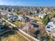 An aerial view of a well-planned neighborhood with mature trees and manicured lawns at 5370 W 74Th Ave, Arvada, CO 80003