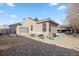 Backyard with covered patio and gravel landscaping at 5370 W 74Th Ave, Arvada, CO 80003