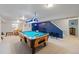 Entertainment basement with a pool table, bar seating, and stylish decor, perfect for relaxation and recreation at 5370 W 74Th Ave, Arvada, CO 80003