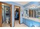Bathroom showcasing a vanity with double sinks, a separate toilet room, and a walk-in closet at 5370 W 74Th Ave, Arvada, CO 80003