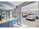 Ensuite bathroom featuring a vanity with a sink and access to a bedroom at 5370 W 74Th Ave, Arvada, CO 80003