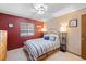 Comfortable bedroom with striped bedding, natural light, and carpet at 5370 W 74Th Ave, Arvada, CO 80003