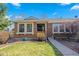 Charming brick home with well-maintained front lawn and landscaping at 5370 W 74Th Ave, Arvada, CO 80003