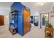 Hallway featuring an open concept view of the living room with fireplace at 5370 W 74Th Ave, Arvada, CO 80003
