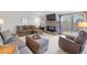 Comfortable living room with a fireplace, plush seating, and a sliding glass door at 5370 W 74Th Ave, Arvada, CO 80003