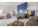 Spacious living room showcasing high ceilings, a bold accent wall, and comfortable, neutral-toned furniture at 5370 W 74Th Ave, Arvada, CO 80003