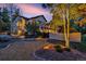 Back exterior of home with a well-manicured lawn and mature trees offering privacy at 17995 Minglewood Trl, Monument, CO 80132