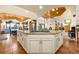 Expansive kitchen island with gas cooktop and seating, ideal for entertaining and Gathering gatherings at 17995 Minglewood Trl, Monument, CO 80132