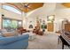 Spacious living room boasts high ceilings, a fireplace, and large windows at 17995 Minglewood Trl, Monument, CO 80132