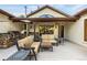 An expansive covered patio with a built-in grill and lounge seating, perfect for entertaining at 17995 Minglewood Trl, Monument, CO 80132
