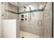 Updated walk-in shower with tiled walls and convenient shower accessories at 17995 Minglewood Trl, Monument, CO 80132