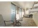 A spacious balcony with tiled floors features comfortable seating and outdoor cooking at 601 W 11Th Ave # 910, Denver, CO 80204