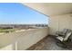 A spacious balcony with tiled floors provides a panoramic view of the city skyline at 601 W 11Th Ave # 910, Denver, CO 80204