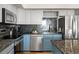 Well-equipped kitchen with stainless steel appliances, granite countertops, and ample cabinet space at 601 W 11Th Ave # 910, Denver, CO 80204