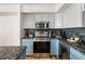 Sleek kitchen design with granite countertops, stainless steel appliances, and overhead lighting at 601 W 11Th Ave # 910, Denver, CO 80204