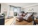 Cozy living room with lots of natural light, hardwood floors and large windows with amazing views at 601 W 11Th Ave # 910, Denver, CO 80204