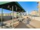 Inviting outdoor dining area offering covered seating and stunning city views in the background at 601 W 11Th Ave # 910, Denver, CO 80204