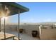 Expansive outdoor patio with shaded seating area and picturesque mountain views in the distance at 601 W 11Th Ave # 910, Denver, CO 80204