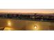 Wide rooftop view shows open area with outdoor lighting and building lights in the distance at 601 W 11Th Ave # 910, Denver, CO 80204