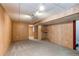 View of the finished basement area with recessed lighting, wood paneling, and neutral carpet at 10406 Drake Pl, Parker, CO 80134