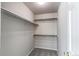 This large walk-in closet features ample shelving and plenty of space for storage at 10406 Drake Pl, Parker, CO 80134