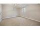 This carpeted bedroom provides a serene space with windows and plenty of natural light at 5523 E Utah Pl, Denver, CO 80222
