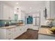 Charming kitchen with bright backsplash, plentiful cabinet space, and modern appliances at 5523 E Utah Pl, Denver, CO 80222