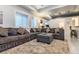 Finished basement with large sectional couch, wet bar area, and recessed lighting at 3227 Quivas St # 1, Denver, CO 80211