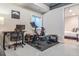 Finished basement gym area with exercise bike, free weights, and rubber flooring at 3227 Quivas St # 1, Denver, CO 80211