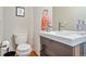 Modern half bathroom with a stylish vanity, sleek fixtures, and contemporary design at 3227 Quivas St # 1, Denver, CO 80211