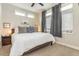 Relaxing bedroom featuring soft lighting, neutral colors, a ceiling fan and comfortable furnishings at 3227 Quivas St # 1, Denver, CO 80211