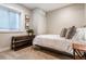 Cozy bedroom featuring neutral tones, a storage console, and a sunlit window at 3227 Quivas St # 1, Denver, CO 80211