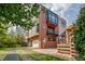 Contemporary brick home featuring attached garage, balcony, and modern architectural details at 3227 Quivas St # 1, Denver, CO 80211