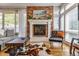 Inviting living room featuring a fireplace, hardwood floors, and comfortable seating at 3227 Quivas St # 1, Denver, CO 80211