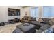 Cozy living area with comfortable seating, mounted TV, and ample natural light at 3227 Quivas St # 1, Denver, CO 80211