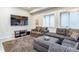 Inviting living area with sectional seating, mounted TV, and modern decor at 3227 Quivas St # 1, Denver, CO 80211