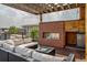 Inviting roof deck featuring a brick fireplace, seating area, and sleek modern design at 3227 Quivas St # 1, Denver, CO 80211