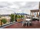 Spacious roof deck with city views and dining set for outdoor entertaining at 3227 Quivas St # 1, Denver, CO 80211