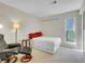 Well-lit bedroom features a white platform bed with storage drawers and a comfortable armchair at 1890 Argentine St # D203, Georgetown, CO 80444