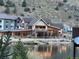 Scenic lake front view of a beautiful lodge style home and mountain views at 1890 Argentine St # D203, Georgetown, CO 80444