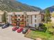 Beautiful multi-story condo building with well-maintained landscaping and private balconies at 1890 Argentine St # D203, Georgetown, CO 80444