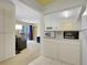 Bright, open kitchen featuring white cabinets and modern appliances, conveniently adjacent to the living area at 1890 Argentine St # D203, Georgetown, CO 80444