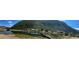 Scenic view of the lake with homes, a bridge, and lush mountains in the background at 1890 Argentine St # D203, Georgetown, CO 80444