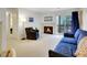 Comfortable living room with a fireplace, balcony access, and stylish furnishings at 1890 Argentine St # D203, Georgetown, CO 80444