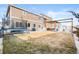 Spacious backyard with patio, trampoline, and pergola, great for outdoor relaxation and recreation at 5318 Truckee St, Denver, CO 80249