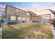 Large backyard with a pergola, patio, and trampoline, perfect for outdoor fun and entertaining at 5318 Truckee St, Denver, CO 80249