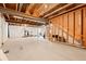 Unfinished basement space with exposed beams and a blank canvas, ready for customization at 5318 Truckee St, Denver, CO 80249