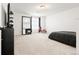 Expansive bedroom with neutral carpeting, large windows, and plenty of space at 5318 Truckee St, Denver, CO 80249
