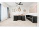 Spacious home office featuring a large desk, black leather sofa, and modern decor at 5318 Truckee St, Denver, CO 80249